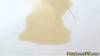 Japanese babe pees puddle